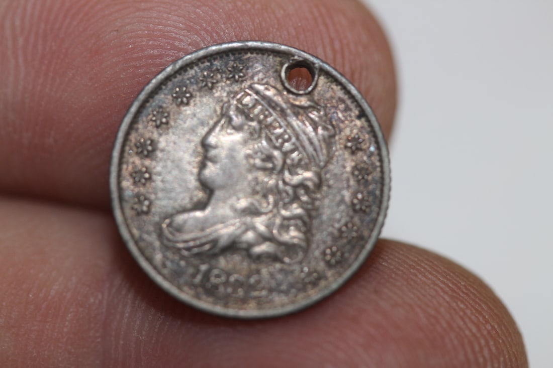 An 1832 Silver Half Dime: please note: hole
