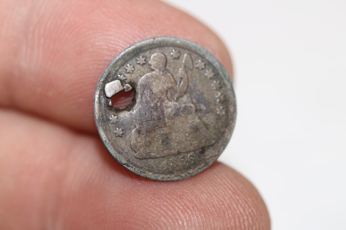 A Silver Half Dime: please note: hole