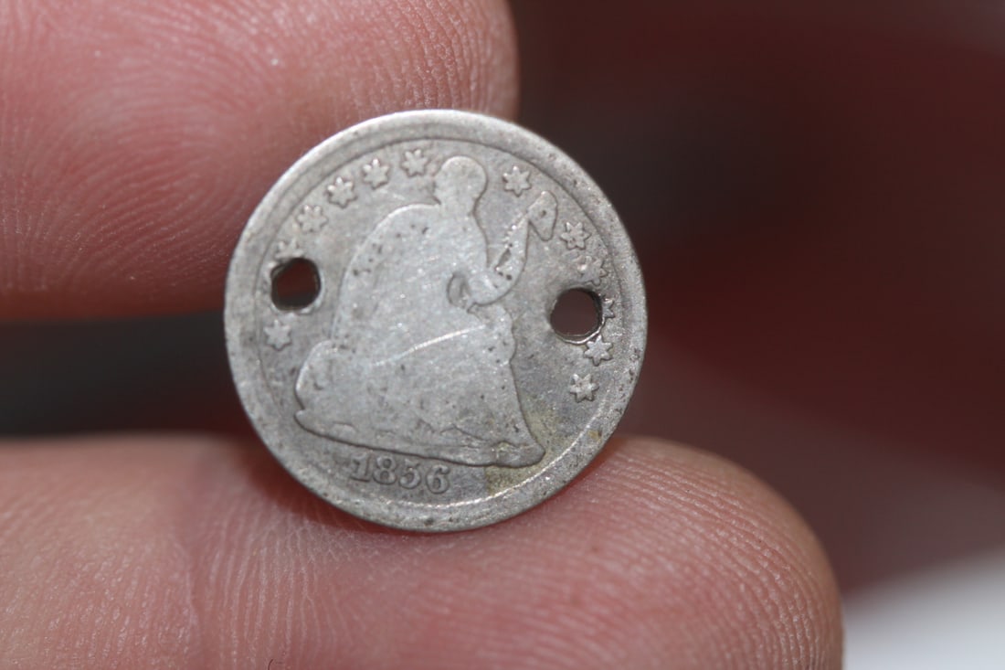 A Silver Half Dime: Please note: hole