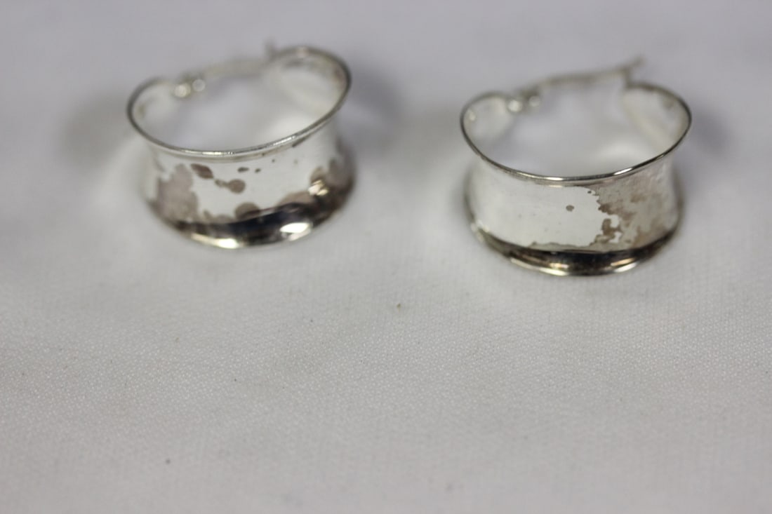 A Pair of Sterling Earrings: as shown