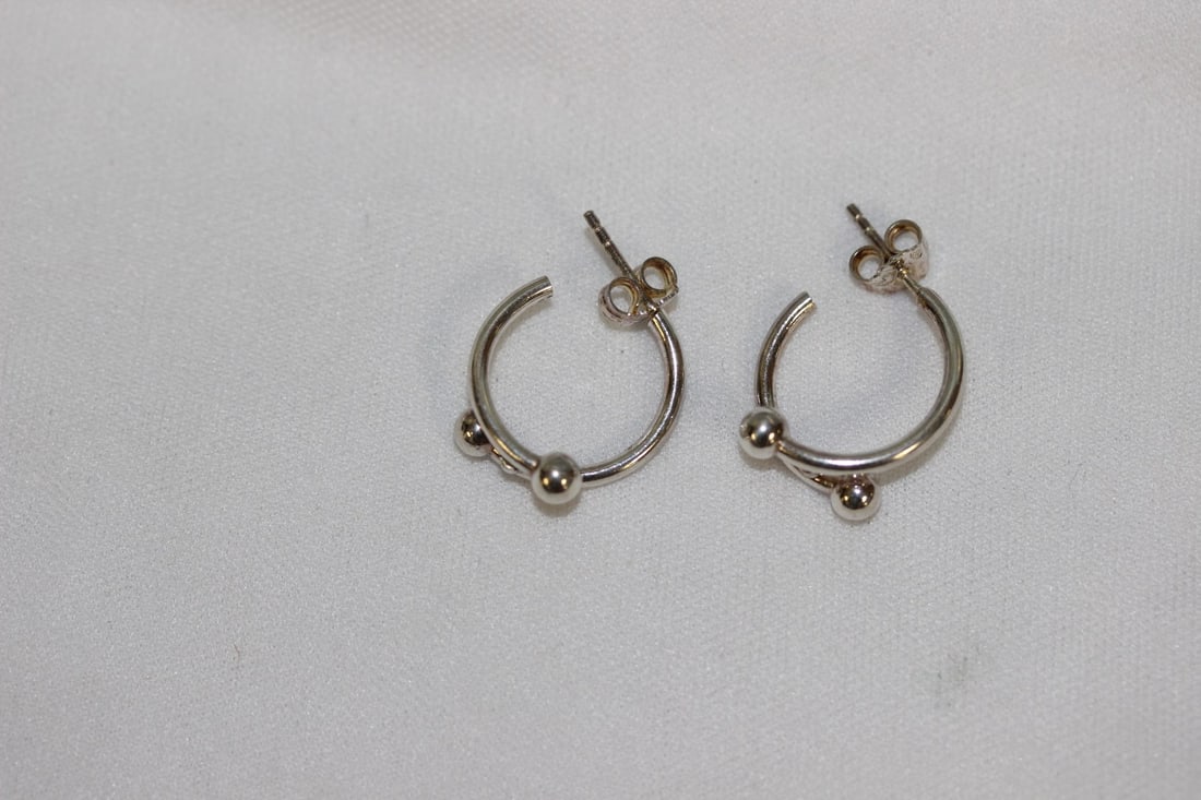 A Pair of Sterling Earrings: as shown