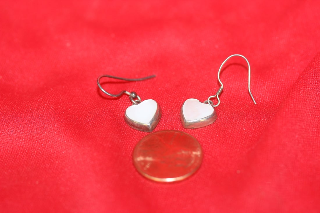 A Pair of Sterling Earrings: as shown