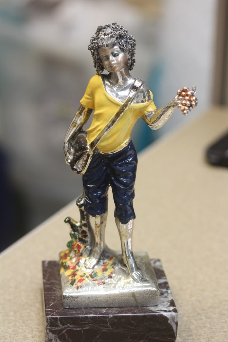 Sterling Foil Wrap Figurine: on marble vase - marked 925 - 7 inches tall