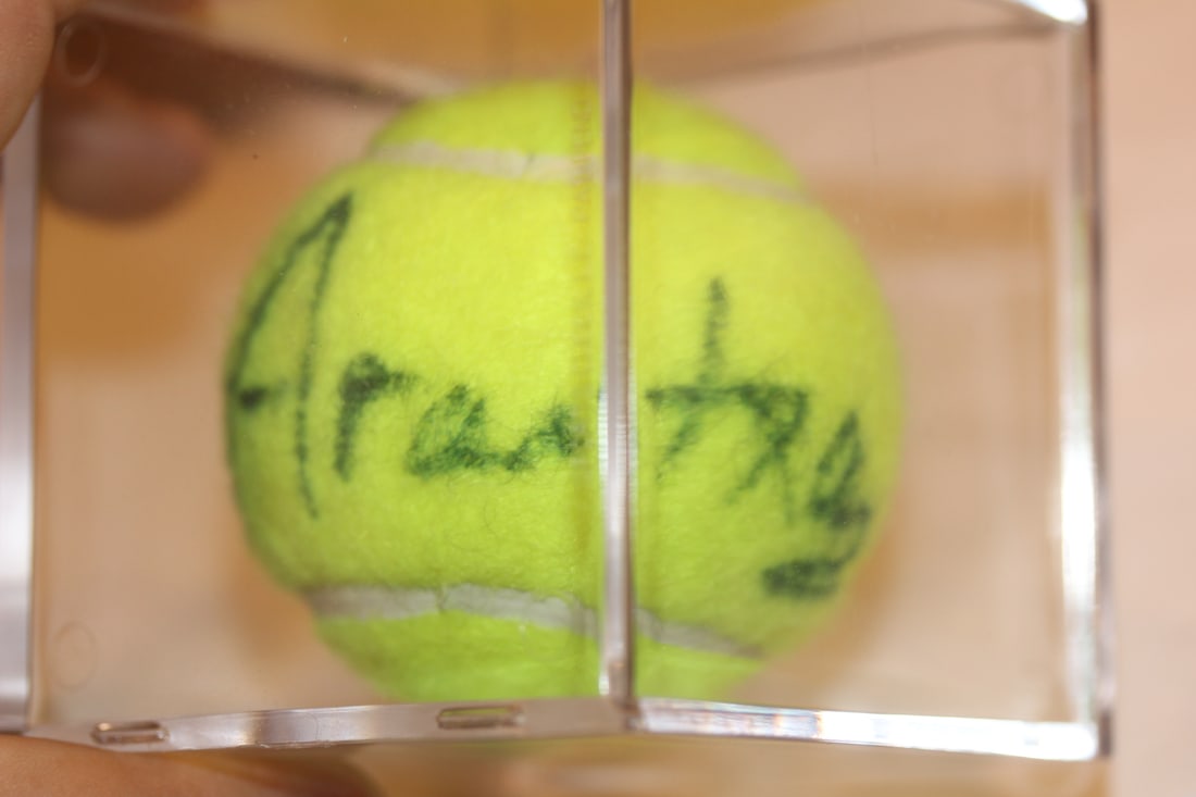 Arantxa Sanchez Signed Tennis Ball: inside a lucite cube