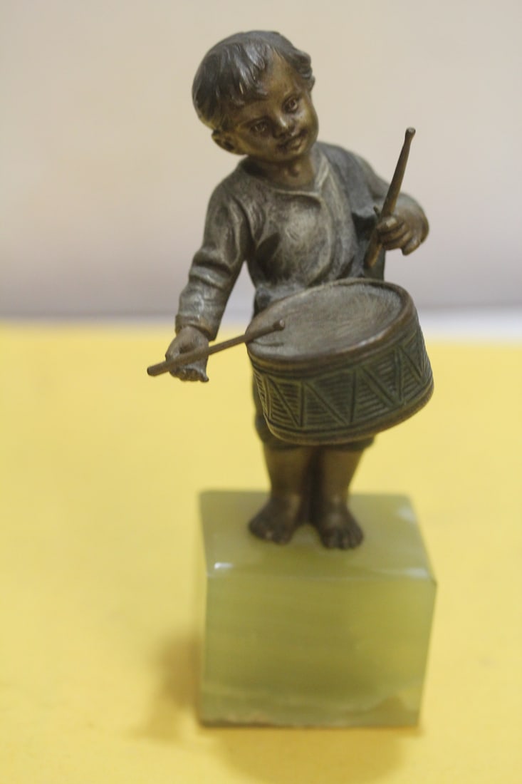 A Bronze Boy Figure on an Onyx Stand: most likely art-deco period - overall= 4 3/4" tall - nicely carved