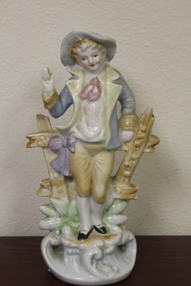 A Vintage Japanese Ceramic Figurine: please note: small part of fence is missing - 9 1/4" tall