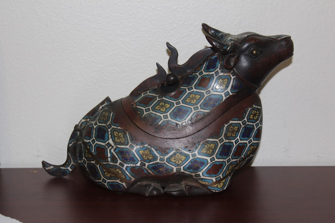A chinese Bronze Ox: signed - possibly an incense burner - 12 inches across - most likely 19th to early 20th century - a beautiful piece