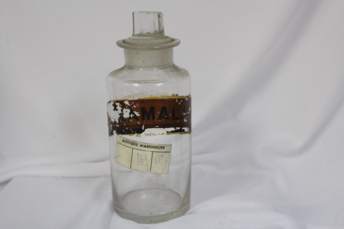 A Vintage/Antique Medicine Bottle: 7 3/4" tall