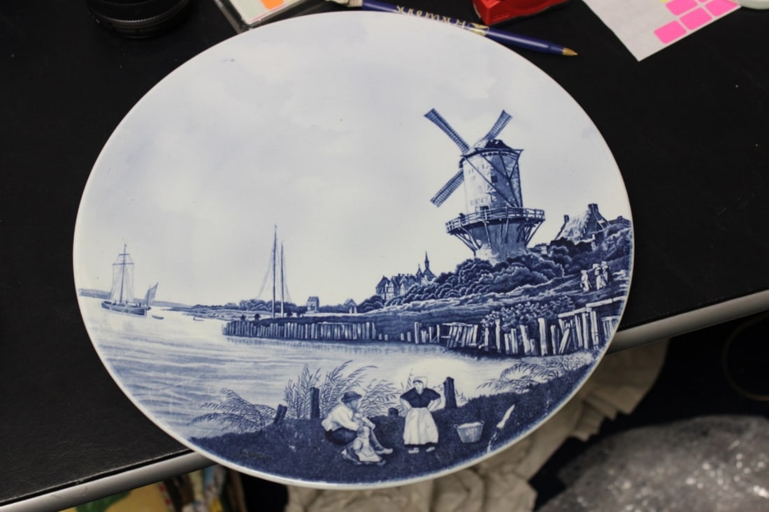 A Delf Wall Hanging Charger: 12 1/4" in diameter - signed on the back