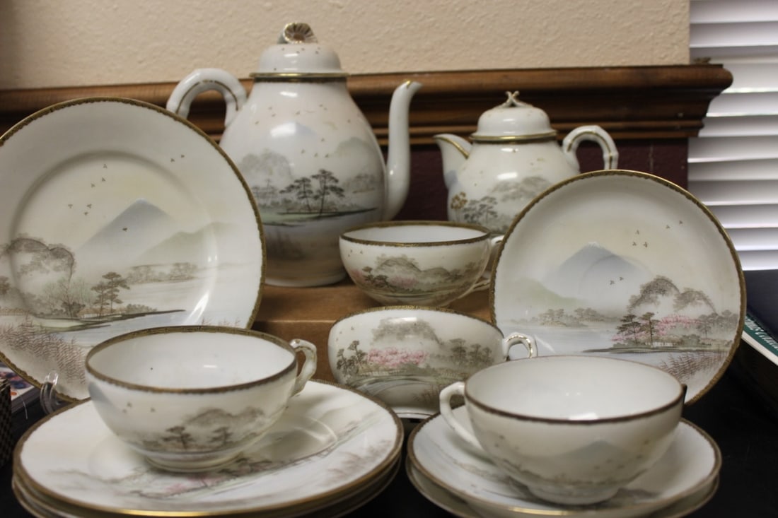 A Set of Kutani Eggshell Teaset: Missing one saucer - signed - Teapot is 8 inches tall