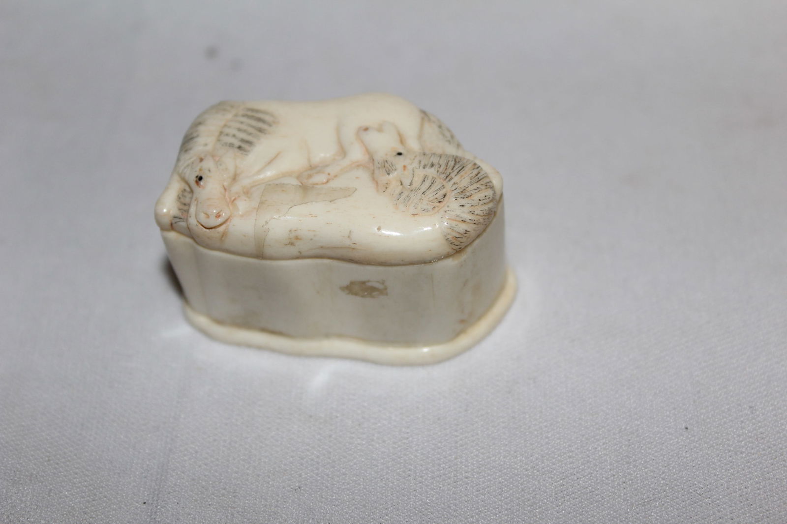 A Signed Japanese Bone Box: 1 3/4" across