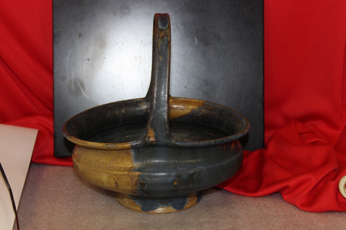 A Pottery Basket: Signed on the bottom - 9 inches tall