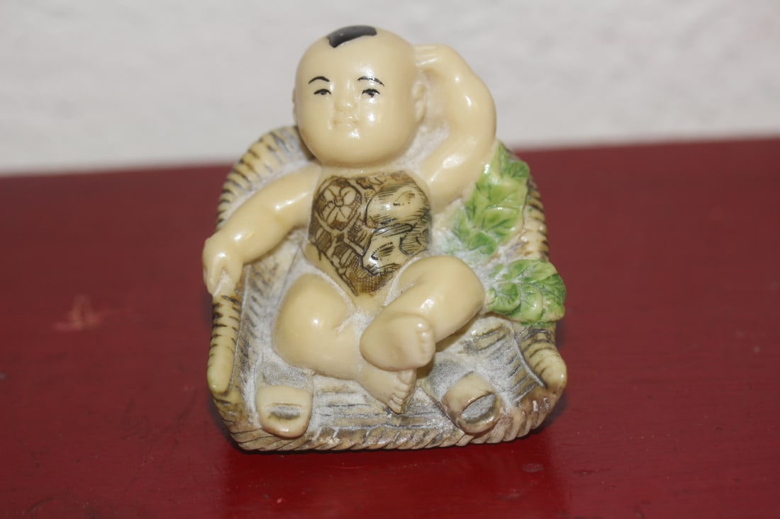 Chinese Resin Sitting Boy: 2 1/8" across