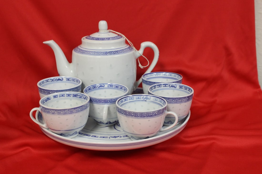 A Chinese Teaset: Teapot and 6 cups with undertray - rice pattern - tray= 10 3/8" in diameter