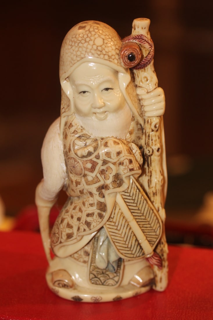 Oriental Man with Egert: resin or composite material - 6 1/4" tall - nicely carved