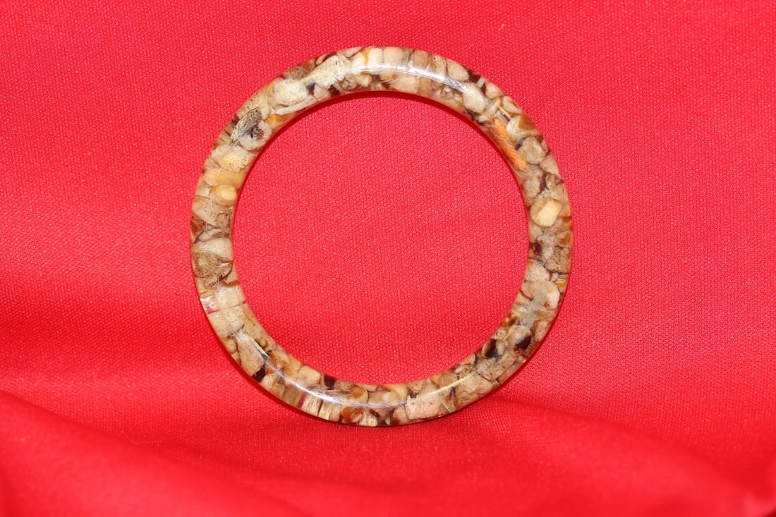 A Lucite or Plastic Bangle Bracelet: 2 1/4" inside diameter
