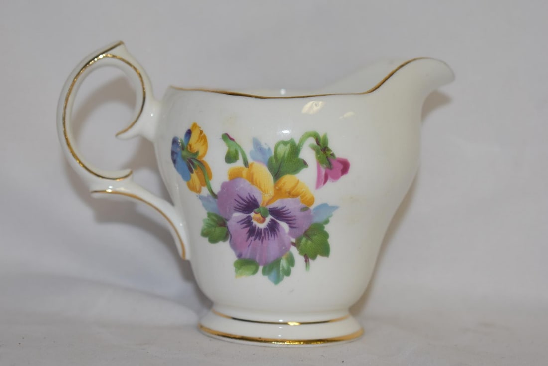 A Queen Ann Bone China Creamer: 4 1/2" in diameter, including the loop