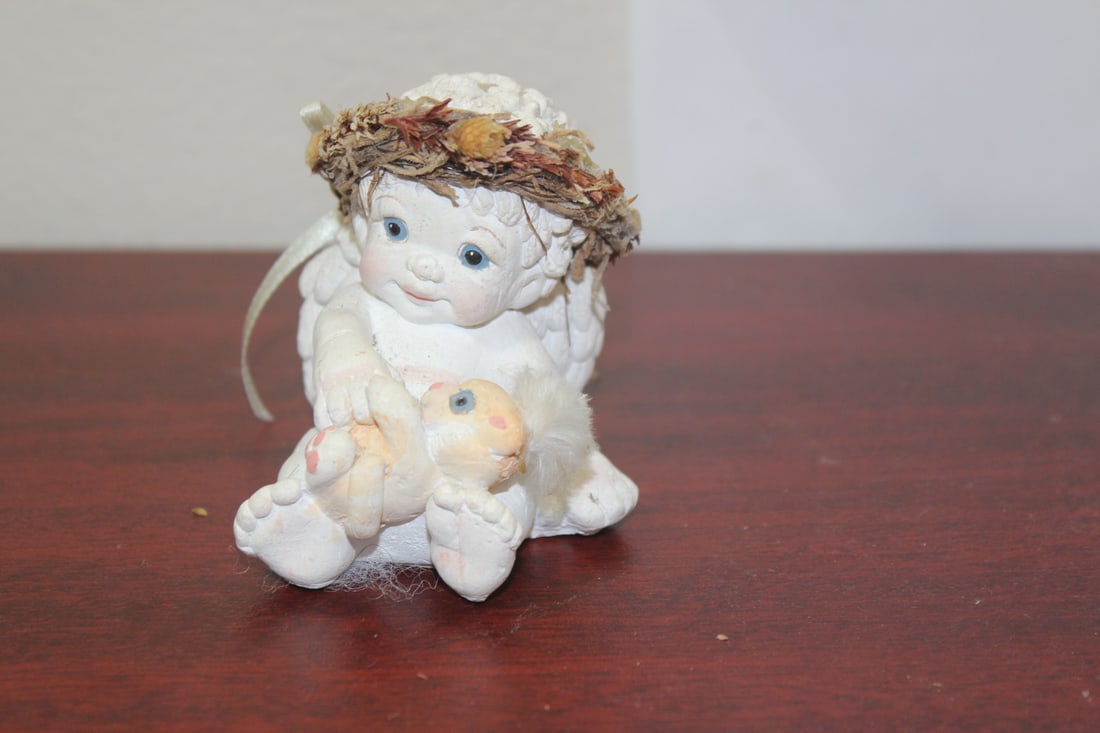 A Carved Angel Figure: 3" tall