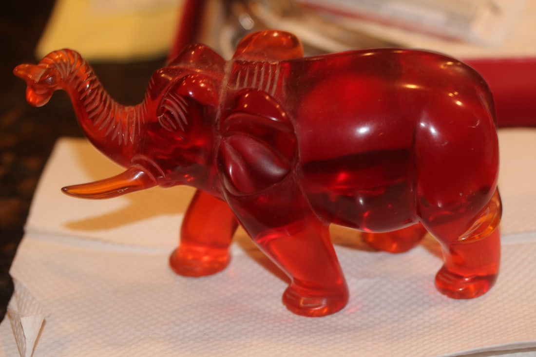 Vintage Chinese Elephant: amber style - trunk up - 6" across