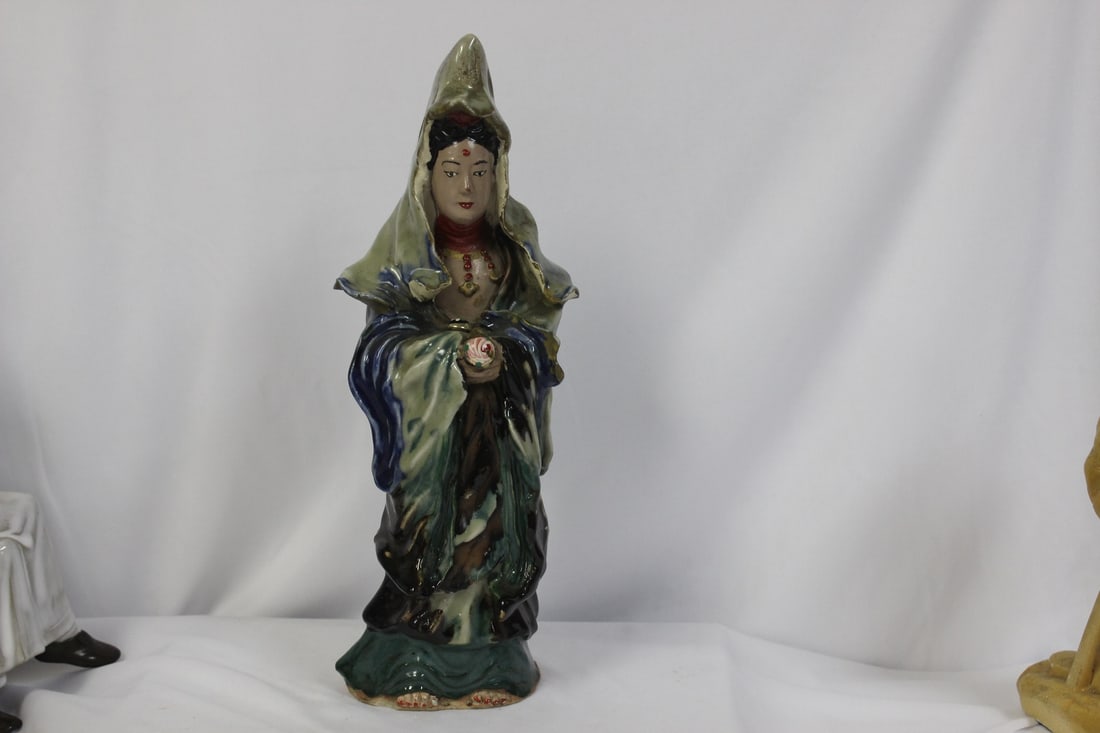 A Chinese Mud Kwan Yin: signed on the foot - 11 1/2" tall