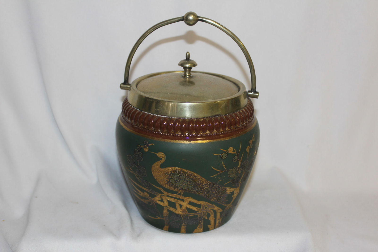 A Signed Ceramic Jar: overall= 8 1/4" tall