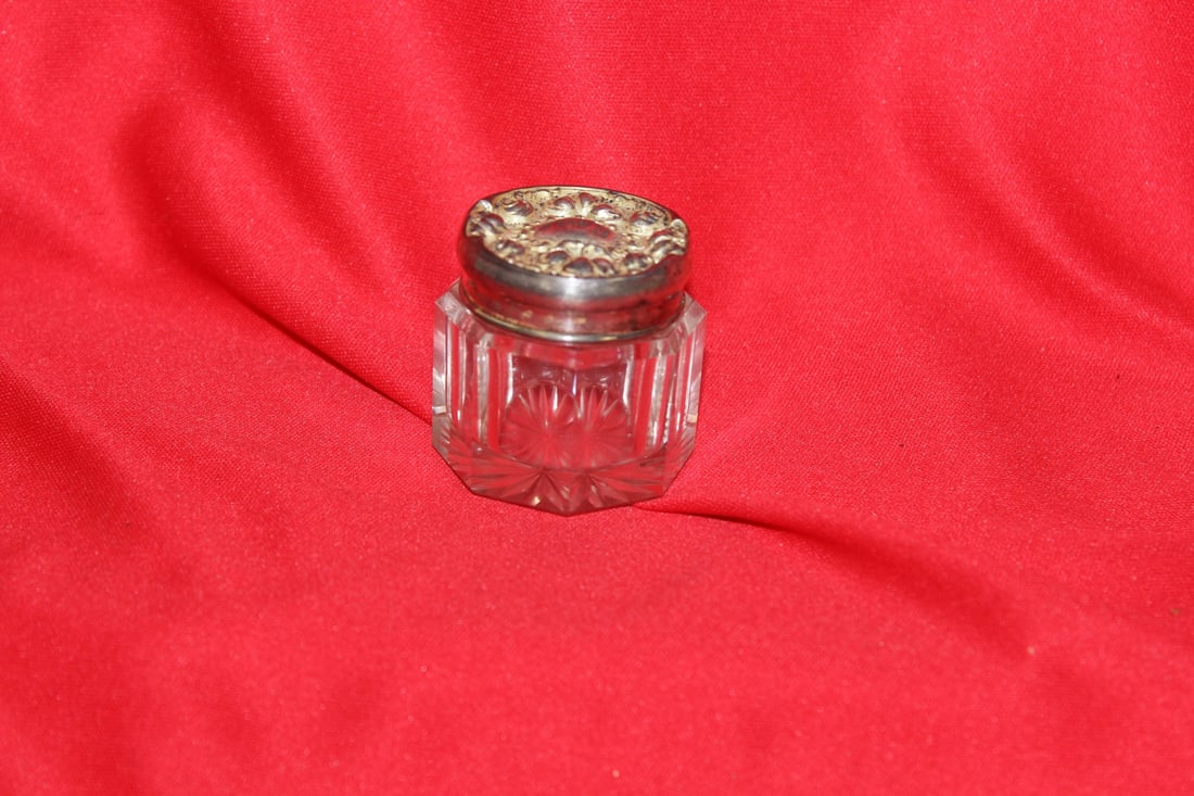 A Sterling Top Ornate Glass Container: 1 1/2" in diameter