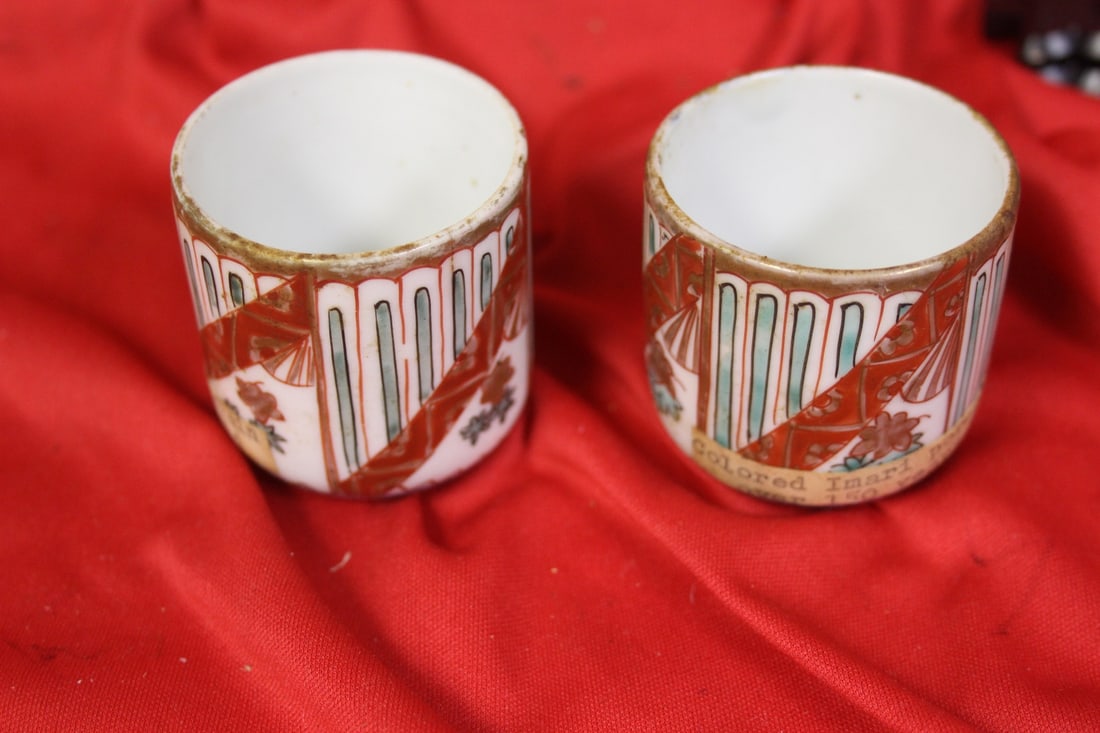 Set of Two Imari Cups: 19th century - please note: one has a hairline - 2 inches tall each