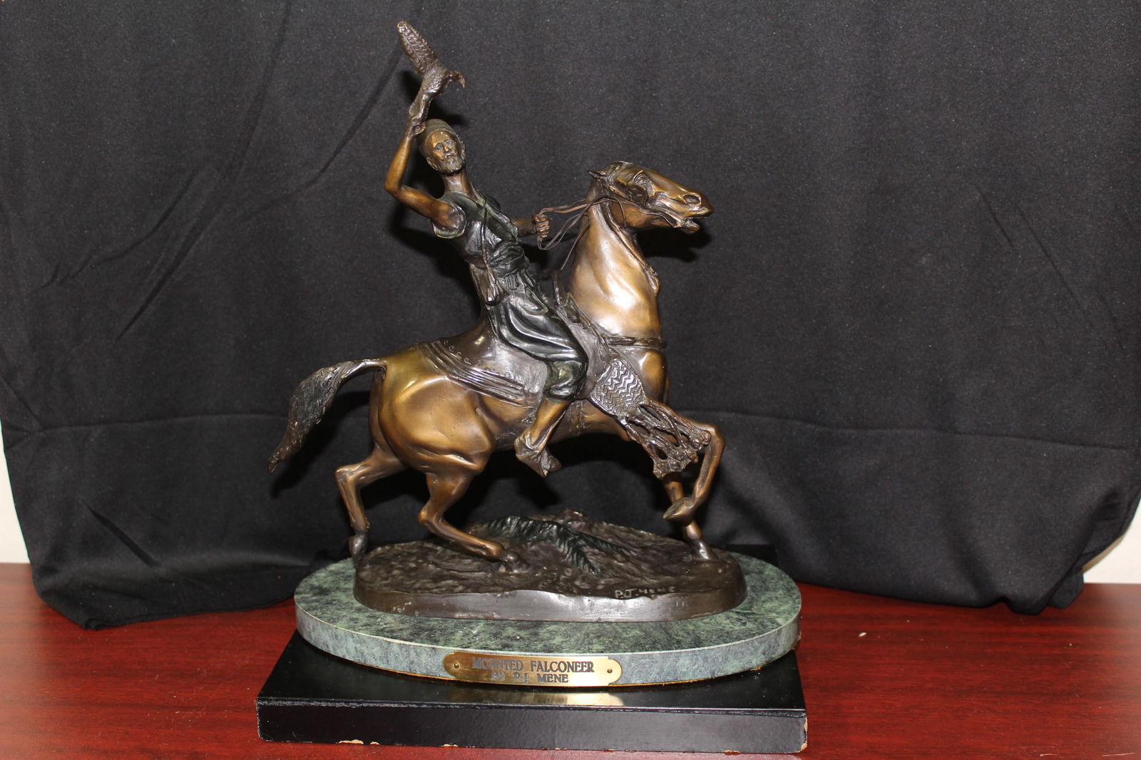 A Bronze Mounted Falconeer by P.J. Mene: exact age unknown - overall= 12 1/2" tall