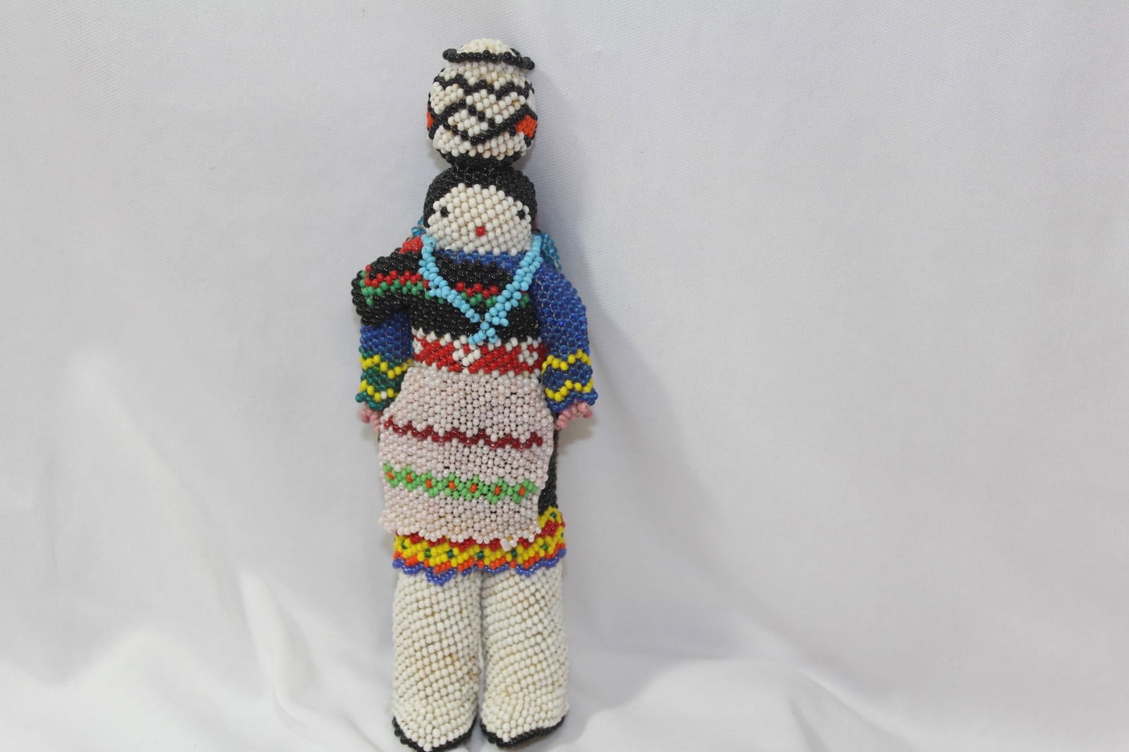 A Beaded Indian Doll: leather - probably 1930's - 6 3/4" tall