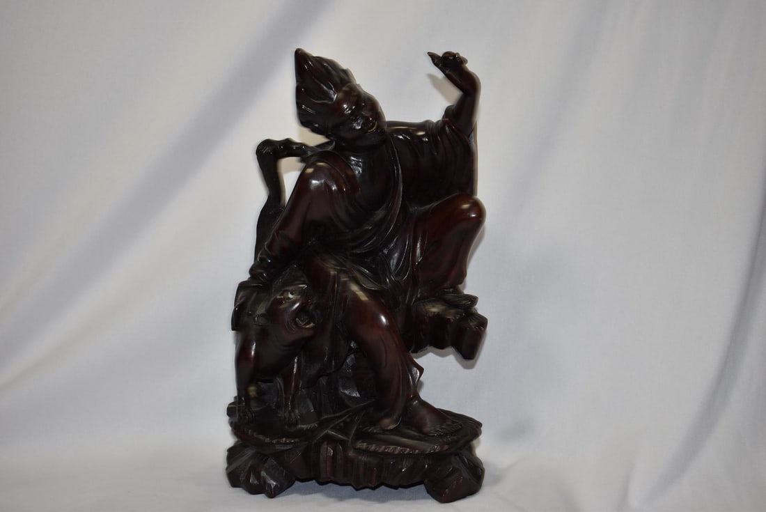 A Chinese Rosewood Figurine: 10 3/4" tall - please note: crack, due to aging