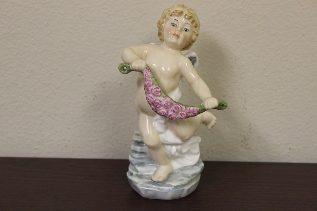 A Doulton Figurine -"Cherubs of the Arts -Dance": 7 1/8" tall