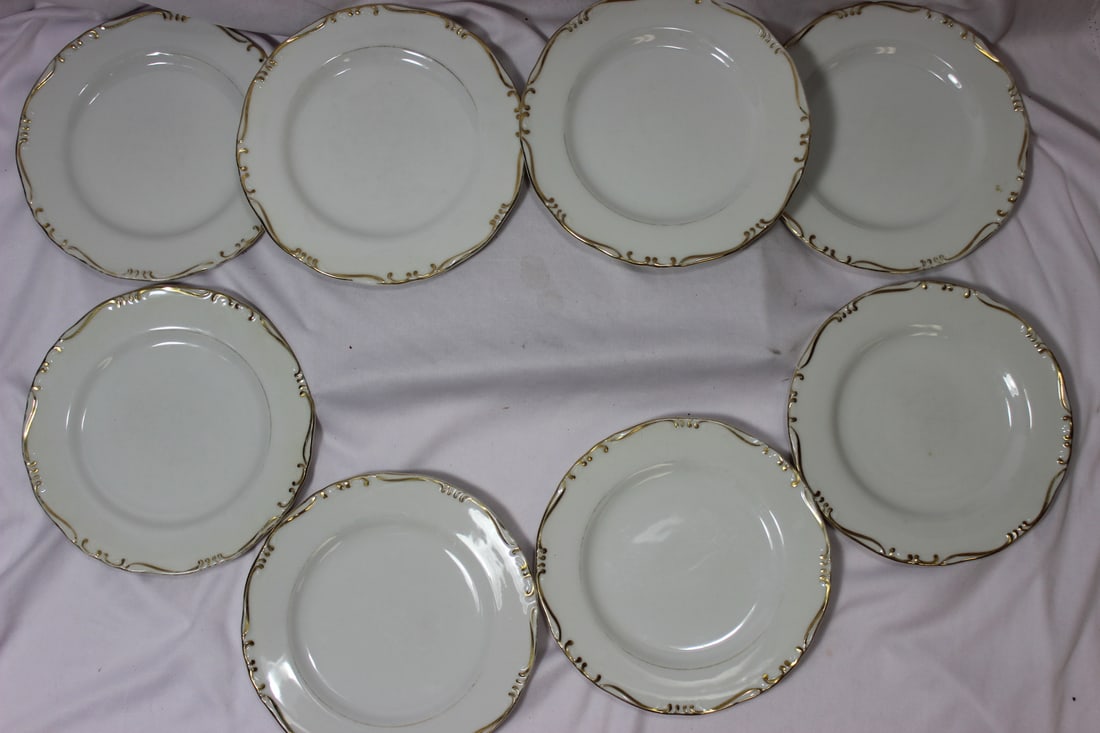 Set of 8 Breadplates: 6 3/4" in diameter each