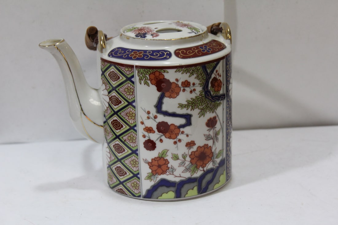 A Vintage Japanese Teapot: 5 5/8" tall - not including the handle