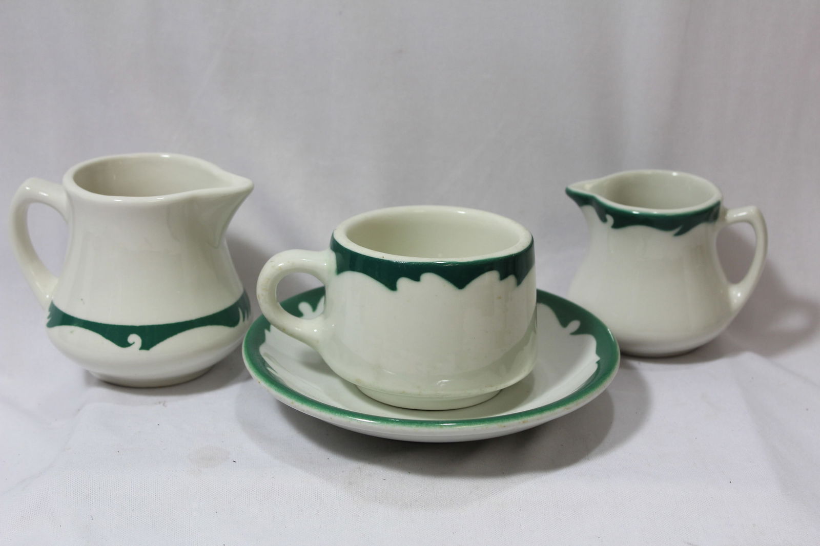 A Set of 4 Ceramic Items: please note: similar pattern, but different manufacturer - tallest= 3 1/2"