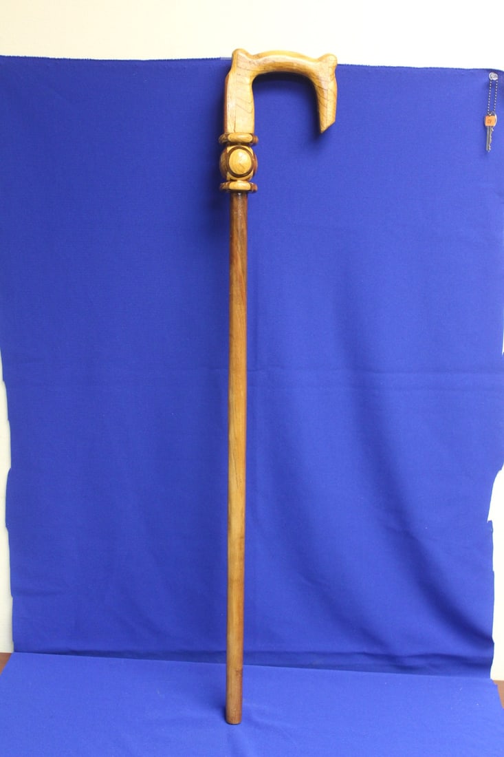 A Carved Wooden Cane: marked Holsinger - 36" long - most likely a custom made cane with previous owner's name 