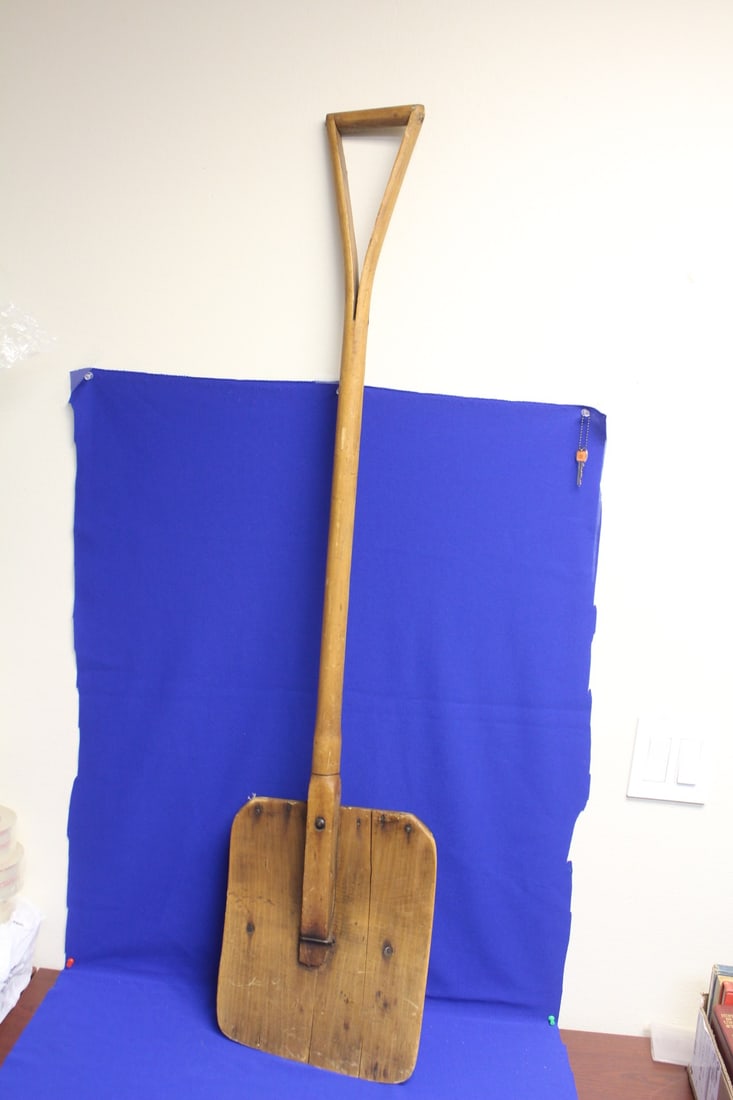 A Primitive Wooden Shovel: 55" tall 