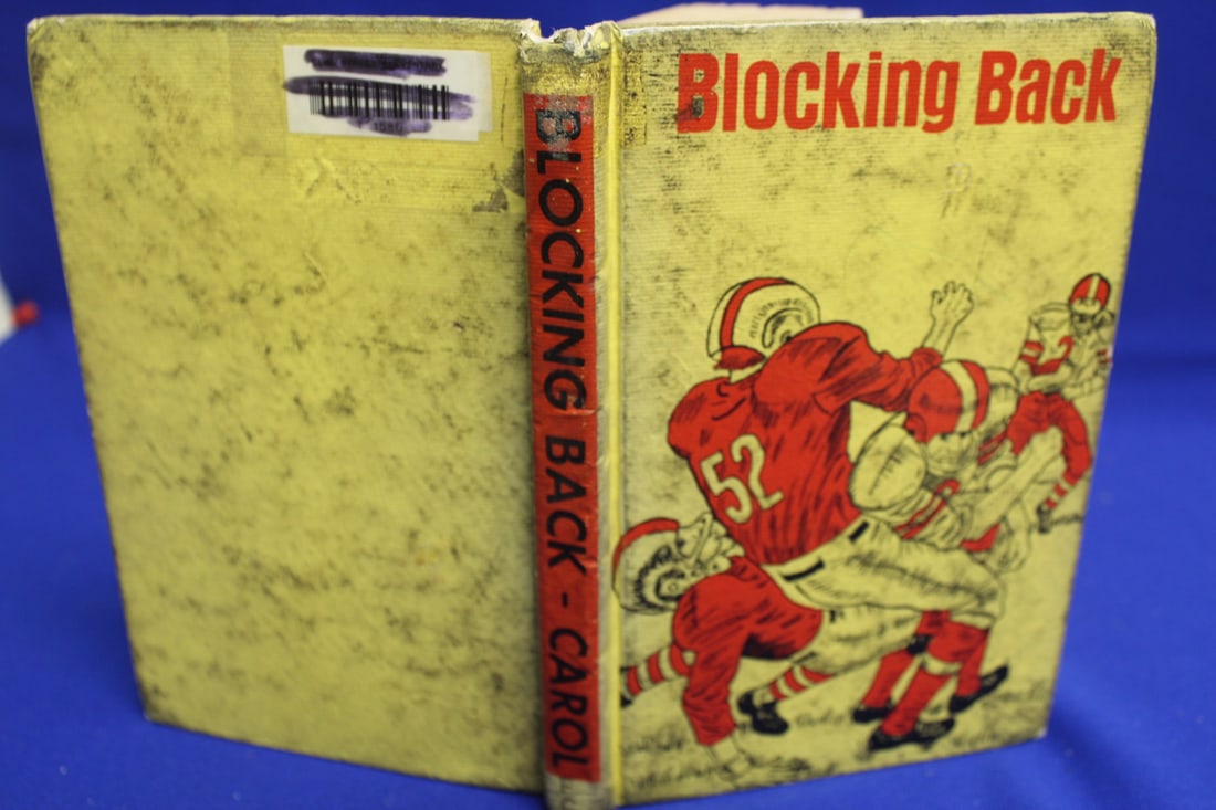 Hardcover Book: Blocking Back: as shown 