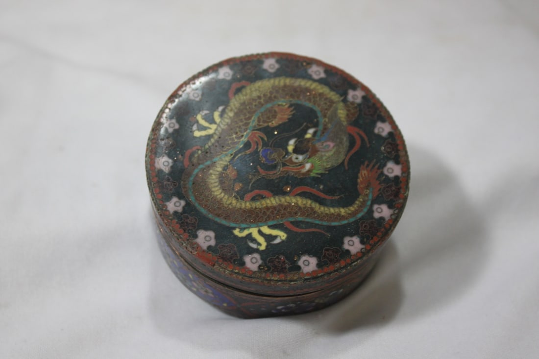 A Cloisonne Dragon Box: probably late 19th to early 20th century - please note: some roughness on the edge as shown - even with all these blemishes, still a good looking box - 4 1/4" in diameter - 1 1/2" tall