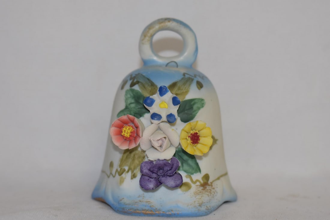 A Ceramic Bell with Clasp: 3 1/2" tall
