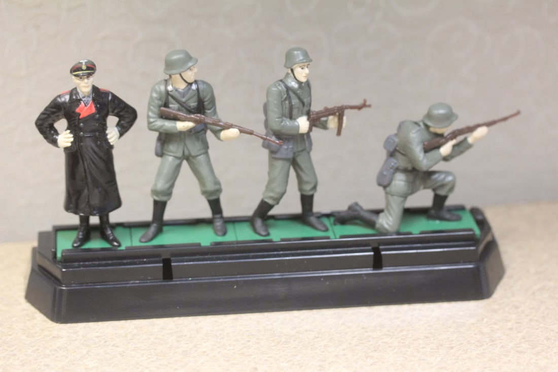 Metal Toy Soldiers on Plastic Stand: approximately 6" across - appeared to be German soldiers type