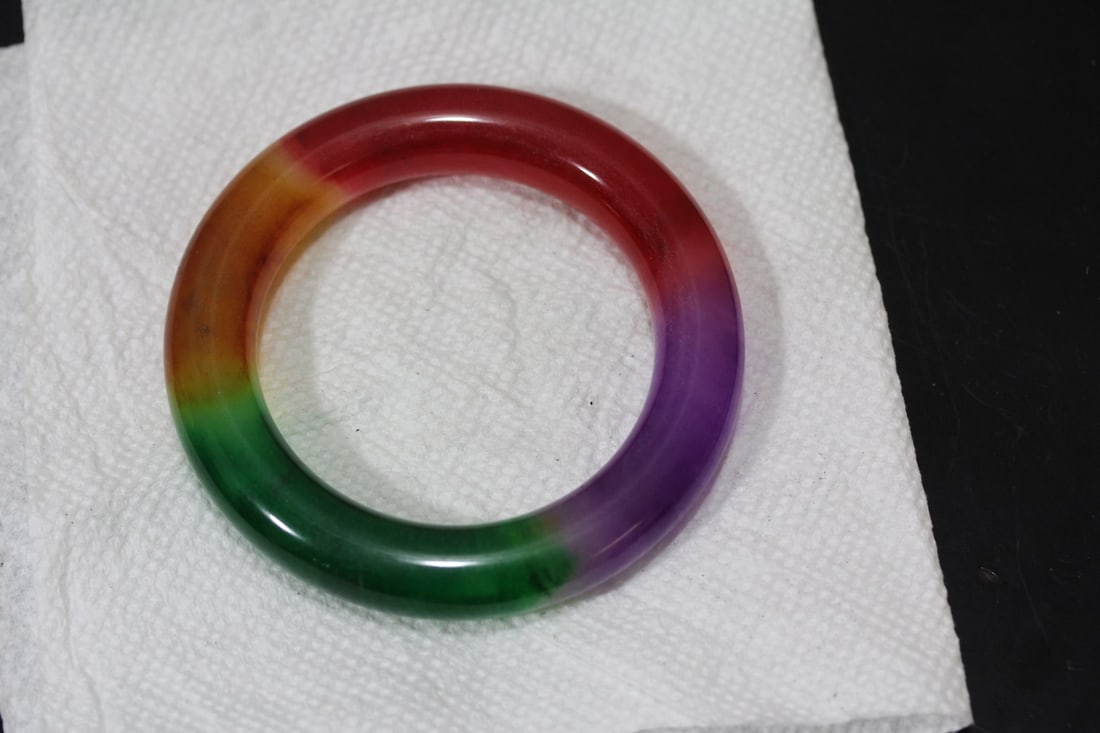 A Thick Multicolor Jadeite Bangle Bracelet: inside diameter= 2 1/4"