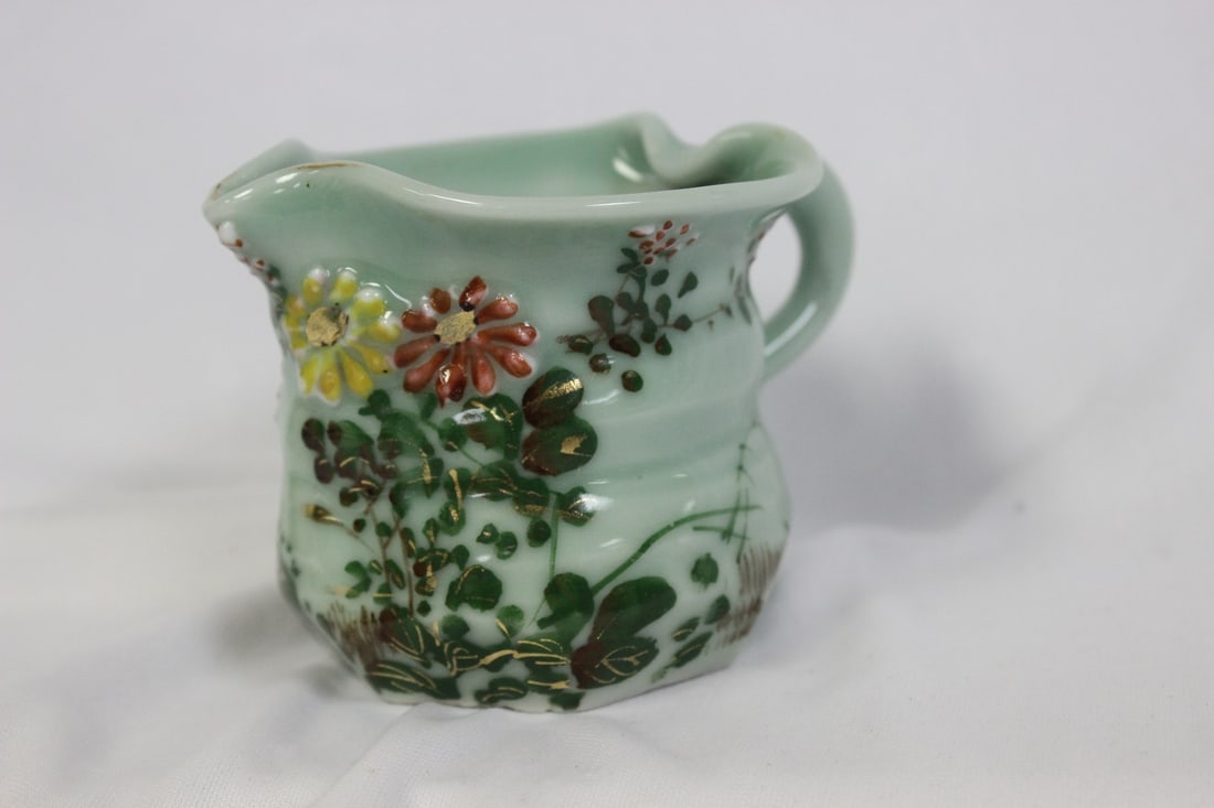 An Asian Celadon Pitcher: Chinese/Japanese/Korean - 3 inches tall