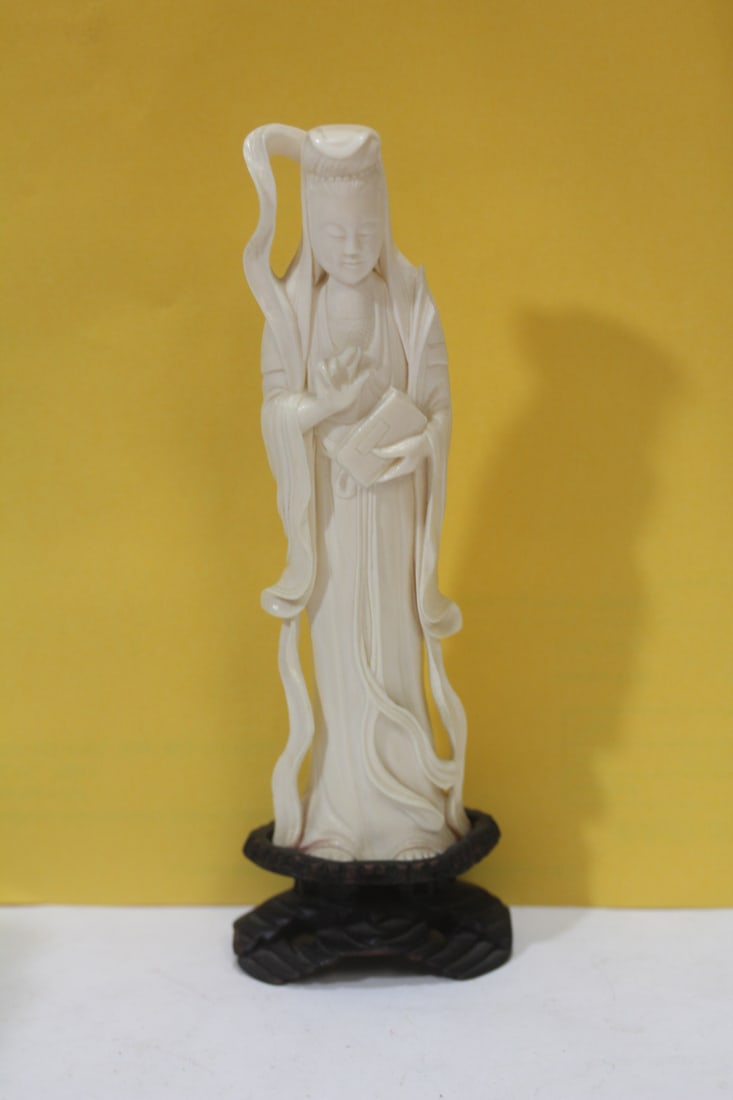 A Carved Bone Figurine: Chinese - please note: break on the shoulder, on stand - 7 1/8" tall
