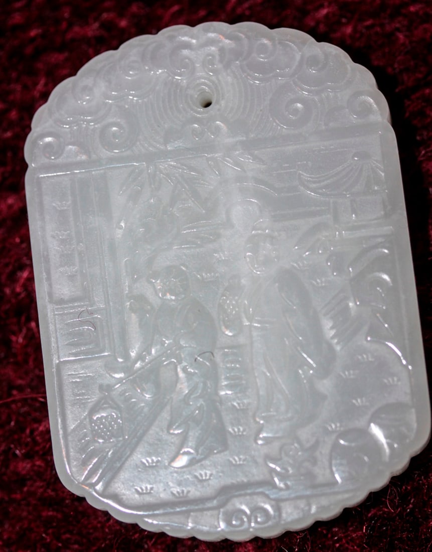 White Jade Pendant: Jade pendant with carved Calligraphy and Court scene. Circa 20th century. Measures 2”