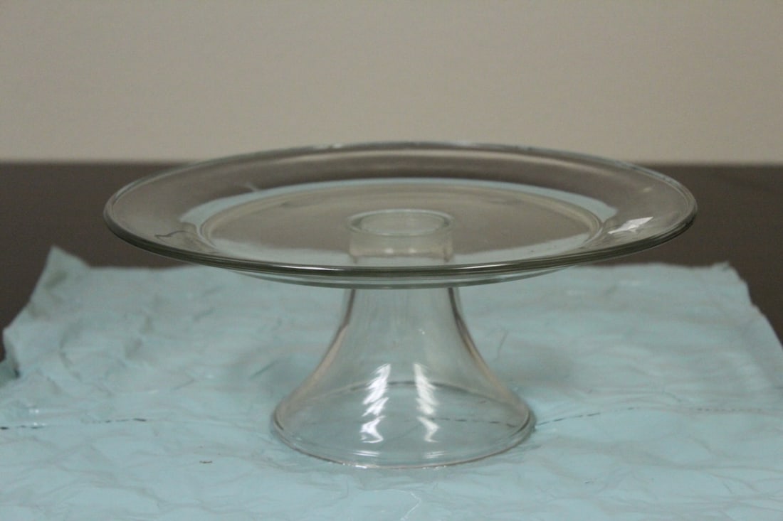 A Glass Cake Plate: please note: a scratch, possibly from manufacturer's defect - 10 1/2" in diameter