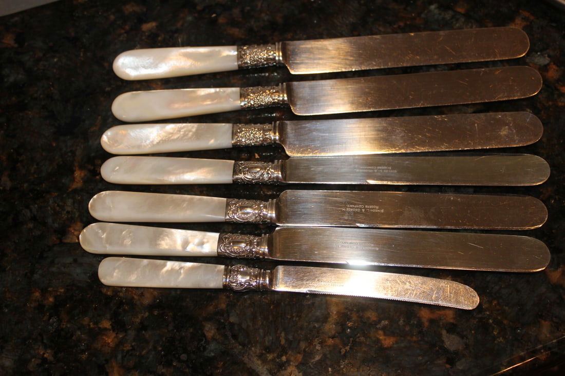 Lot of 7 Mother of Pearl and Sterling Ban Butter Knives: longest= 9 inches