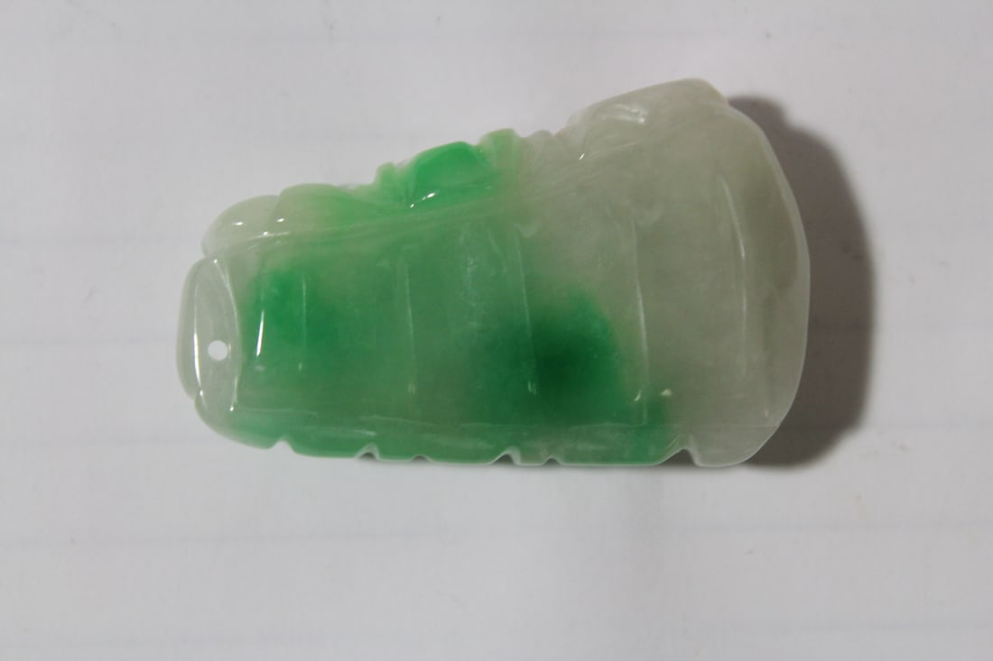 A Jadeite Pendant*** - 2