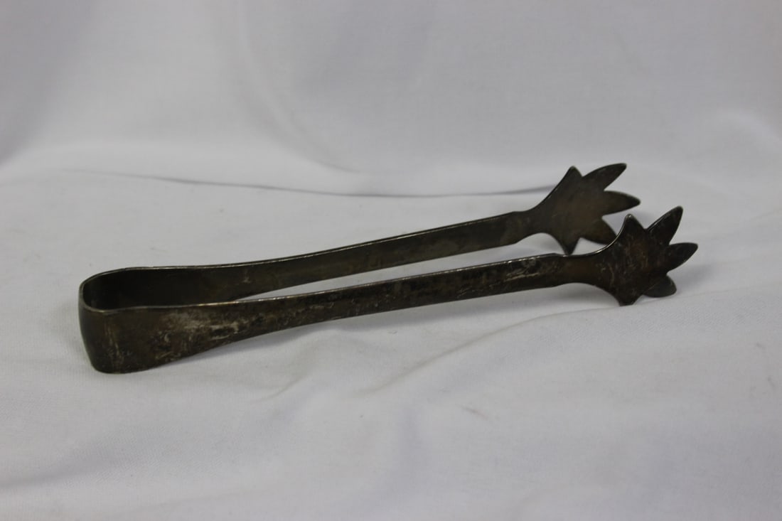 A Silverplated Tong: 6 3/4" long