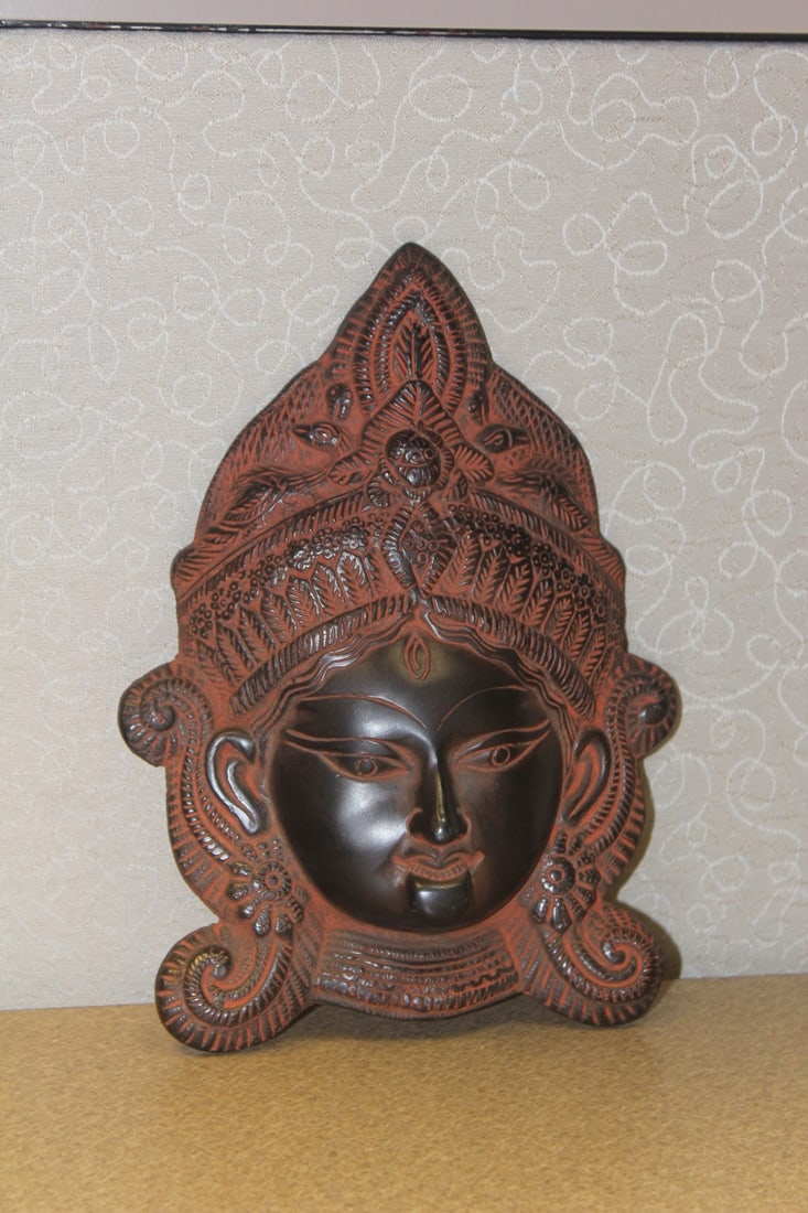 Asian wall hanger: metal, well carved, 8 1/2" across