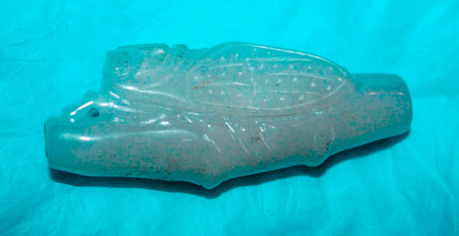 White Jade or Jadeite Cicada on Vine: 2 1/4" long.